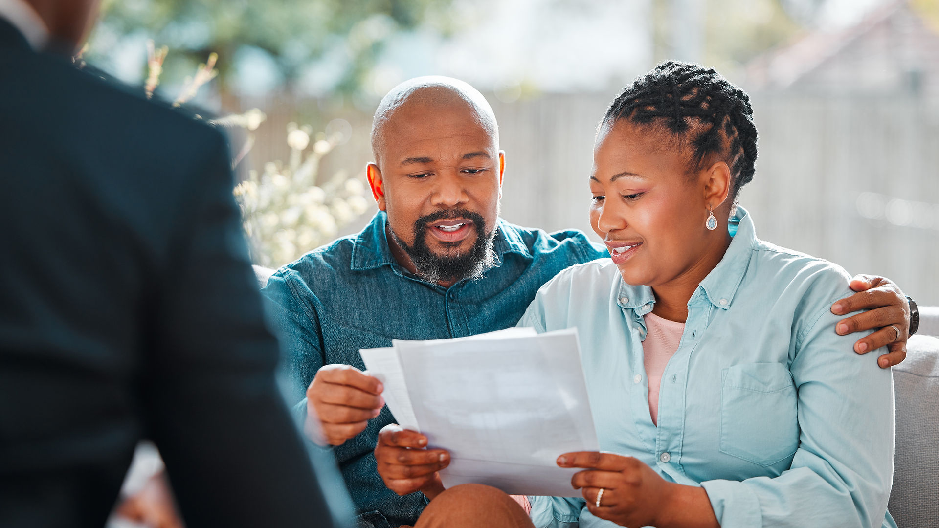 Happy couple, broker and contract in a house for a meeting or consultation for retirement 