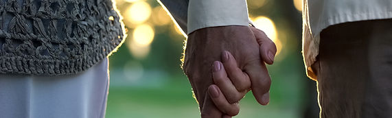 Healthy couple holding hands in retirement